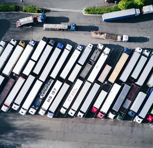 A birds-eye view of various lorries in a line